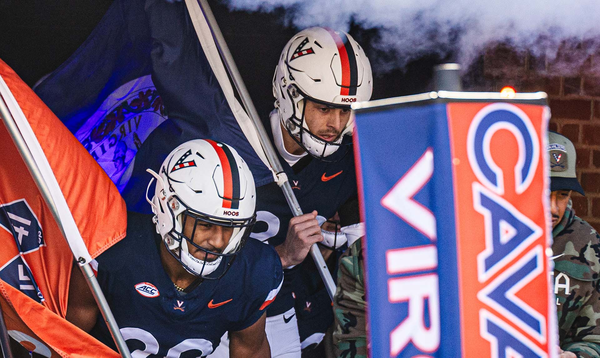 UVA Cavalier football players run out before a game