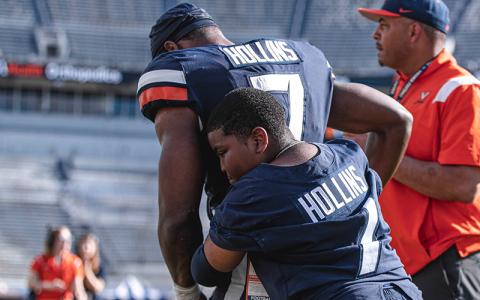 Mike Hollins being embraced by little brother