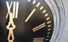 A close up of a clock on Grounds