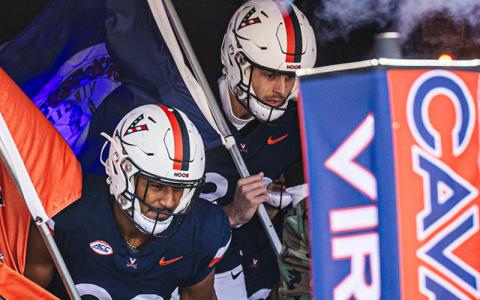 UVA Cavalier football players run out before a game